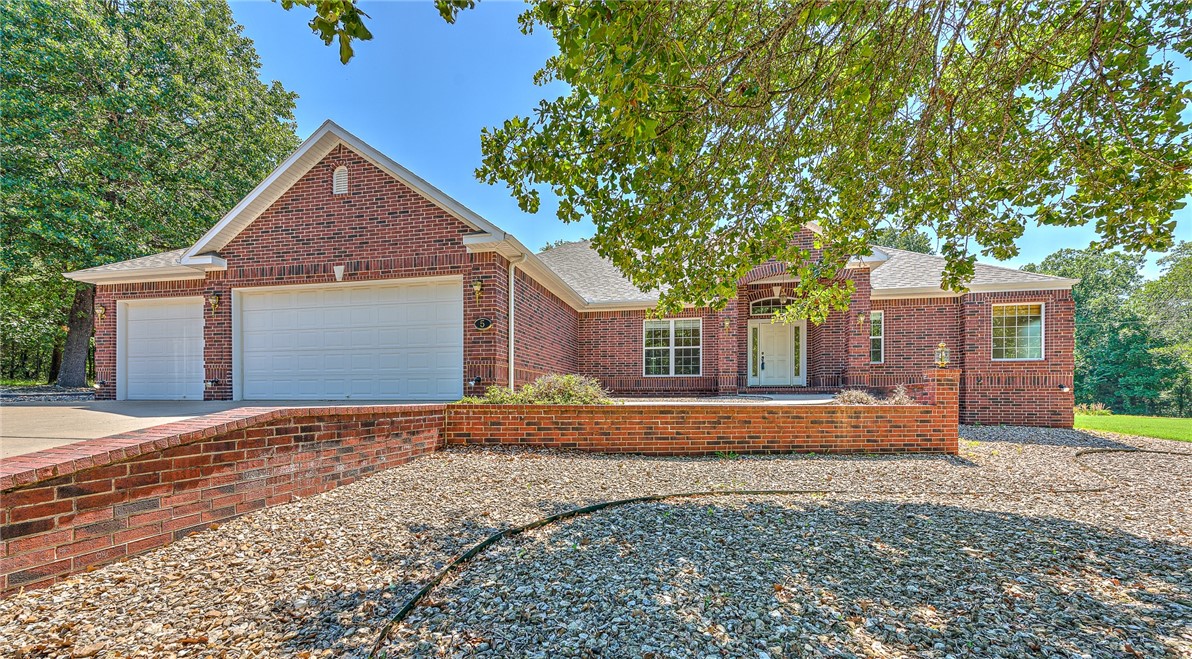 Welcome home to this one-level charming all-brick home nestled on a .63 acre spacious corner lot. Enjoy the serene backdrop of woods lining the rear of the property, offering both privacy and natural beauty. Inside, discover a thoughtfully designed layout featuring a luxurious, private primary suite with a large walk-in, cedar lined closet and bathroom. The open floor plan and large living space provide ample space for comfortable living. Easy maintenance on this flat lot with a gravel front yard that adds to the character of the home. Located near Loch Lomond and the Stoneykirk boat ramp and the Branchwood Recreation Center, this home in the highlands is worth checking out!