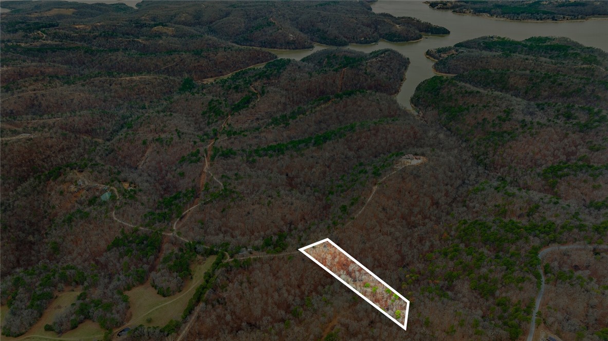 Discover the perfect canvas for your dream home with this stunning 5-acre tract in Emerald Bay subdivision. Boasting breathtaking views and endless potential, this property offers a serene retreat near the lake. While well water and septic are needed, electricity is already on-site, making your building process more convenient.
Located just minutes from the historic War Eagle Mill and a short drive to downtown Rogers, youāll enjoy the perfect balance of peaceful living and easy access to amenities. Whether youāre envisioning a custom home or a weekend getaway, this property provides the ideal setting to bring your vision to life. Donāt miss this rare opportunity to own a slice of Emerald Bay!