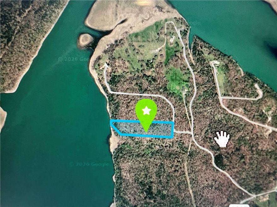 Buildable 5 acre lot with gorgeous lake views. The lot sits on a level ridge top that slopes into Beaver Lake on the western side. There is a private drive that runs the length of the property.  Electricity is located nearby.  Lots of privacy with this property along with multiple options for a location to build your new home.   

Electricity is located nearby. Lots of privacy with this property with no other builds in sight. A great
location for a luxury build or a weekend getaway. Deeded to the Core line