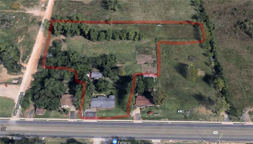 So many possibilities!  Approx. 4.2 acres with a house, barn, RV size building, workshop, small pond, flat with plenty of trees for privacy!  Commercial potential (currently zoned Agriculture) and/or purchase and build your dream home just minutes from downtown Bentonville!  Hwy 102 and Coventry Rd frontage, must see and walk the property!  Home is well maintained and there is also a deep well on the property!