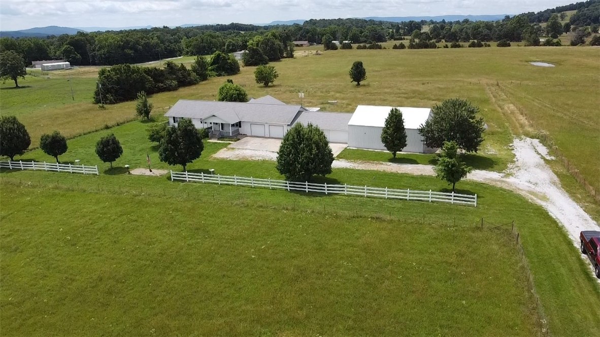 Spacious Ranch Home on 5.49 Acres with Scenic Views & Dream Workshop!
Discover this beautifully maintained 3-bedroom, 3-bath ranch-style home boasting 2,240 sq ft of living space, set on 5.49 peaceful acres. Enjoy the panoramic distant views of Gaither Mountain from the comfort of your sunroom or covered back deck.
Inside, you'll find a spacious layout perfect for both daily living and entertaining. A 22kW propane generator ensures year-round comfort and peace of mind. The oversized 4-car attached garage offers ample storage, and the attached 40x40 heated and cooled workshop is a standout feature—complete with its own office, half bath, and 3-compartment industrial sink.
The fenced backyard is ideal for pets, featuring a charming dog house and plenty of room to roam. Whether you're looking for functionality, privacy, or room to grow, this property checks every box.
