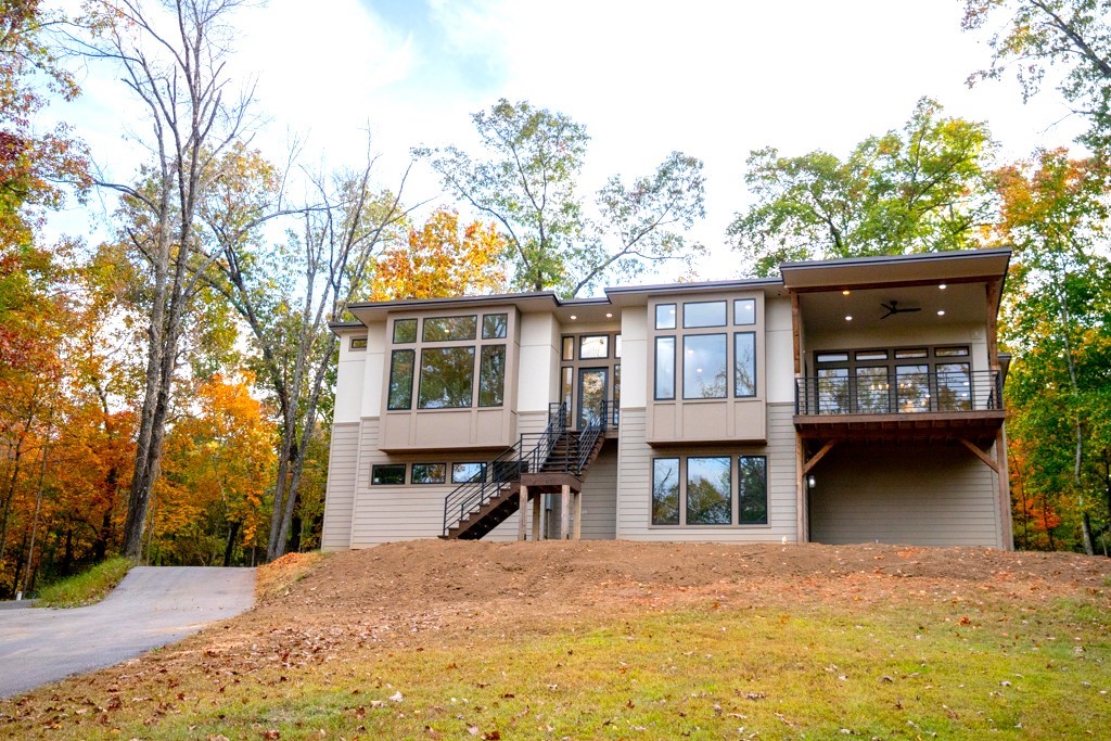 Like new custom build on 3 gorgeous wooded acres! Built in 2022, this stunning contemporary home is uniquely situated between 2 lakes - just 5 minutes from Lake Atalanta and 5 miles from Prairie Creek Marina. Youāll love the privacy this property offers along with the convenience of being 3 short miles from Downtown Rogers, which offers numerous shopping and dining options. This 2879 square foot home is packed with upgrades including quartzite countertops, huge walk-in pantry, metal roof, additional insulation and interior soundproofing, tankless water heater, soft close cabinets, fully integrated home network, walk-in closets in every bedroom, oversized garage, and an abundance of natural light. Every detail was selected with care. This property is truly one-of-a-kind! Schedule your appointment today!