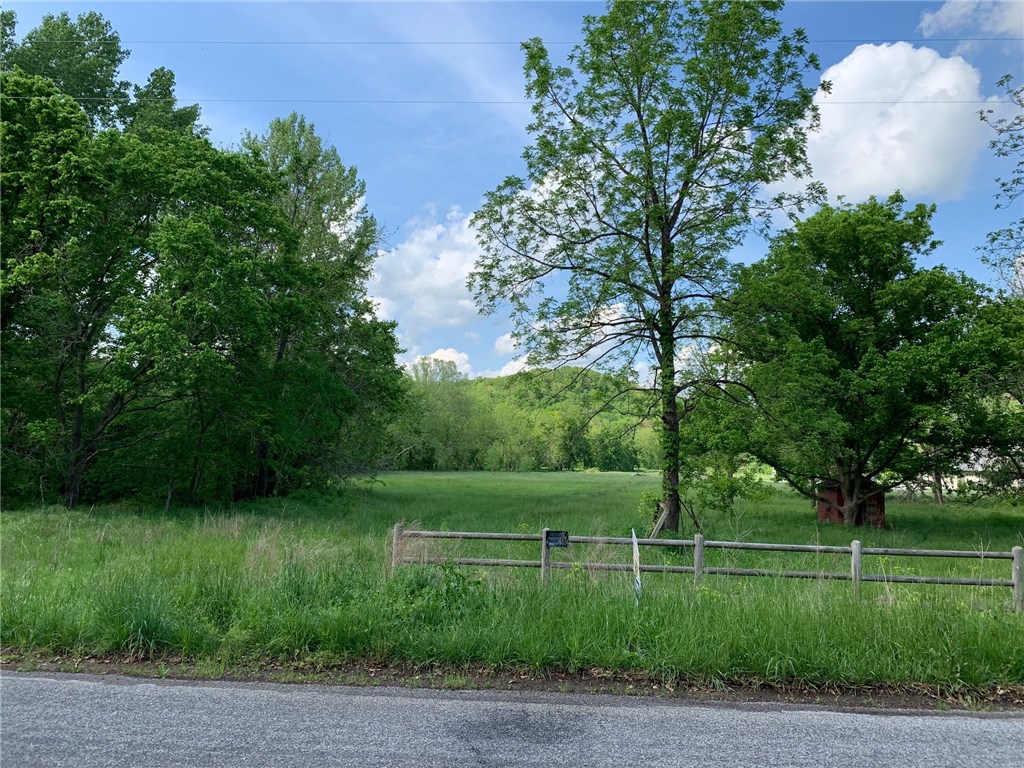 Have you been looking for that special spot to build your dream home?? Here it is! 4 acres located on Ford Springs Road in an area of high-end homes. This level acreage is ready to build on with 2 wells on site. Easy access to I49 and into downtown Bentonville. All paved roads. Short bike ride to the Razorback Green Way or to Slaughter Pen. Wet weather creek along west side. Does not touch Sugar Creek. (Buyer to verify everything to their satisfaction)