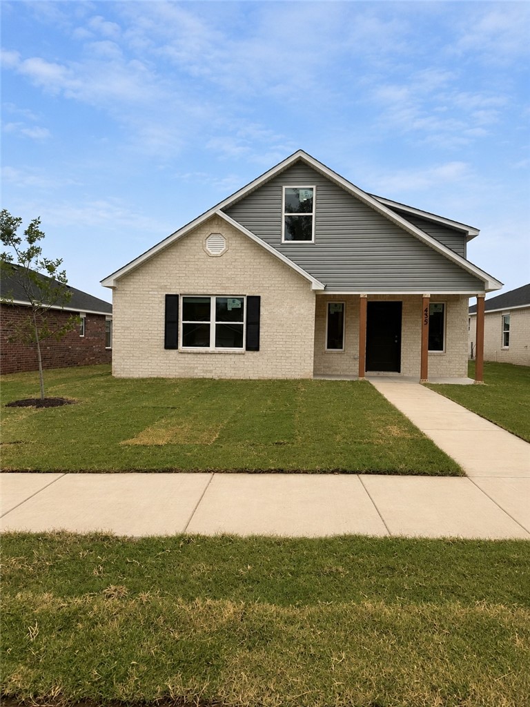 Traditional-style exterior featuring a covered ent