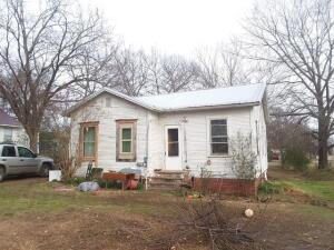 THis property has a house and building on itbut they are not considered at any value.the house is 2bd 1 ba and building has electric.property all needs cleaned up building is of no value Renovations are in process to clean housesold as is Seller is looking at all offers