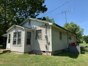 Affordable home priced to sell!!! Great investment property as home is currently rented ($350 monthly). Tenant would like to stay for incomeproduction or will vacate if you would like to fix up to make your own. Nice shaded lot. New metal roof (2007) and new HVAC (2014) add to thevalue and appeal. Property does need a bit of cosmetic upgrades but price accordingly. Closed in front porch adds usable space as well as acarport and attached storage area. Range conveys and other appliances owned by tenant.