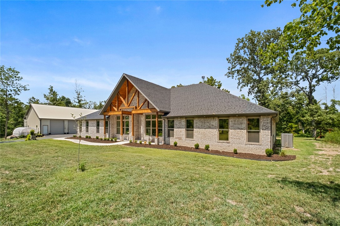 Amazing 2022 Executive Style home located on Hole number 4 on Big Sugar Golf Course. This property offers 4 bedrooms plus office with 3.5 bathrooms. The kitchen is plumbed for a gas stove. This home is built for entertaining guests with a large game room and bar with mini fridge/Ice machine, as well as an amazing, covered patio. There is a 40 x 60 heated and cooled shop with 3 bay doors that will hold all your toys. The shop has 200 amp service with RV hookups. Unique custom features throughout, including large master closet. Minutes from Rogers, Bentonville, and Pea Ridge.