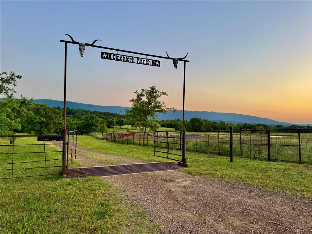 Hunting, cattle and recreational property with amazing views, exceptional hunting and fishing and is thoughtfully set up for cattle grazing and hay production and Black Fork River meanders through.
