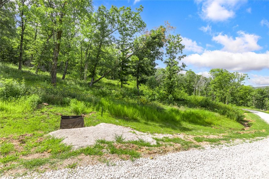 The groundwork is already done for you!  This lot comes fully equipped with underground utilities already in place, including natural gas, fiber optic internet, electric, public water, and sewer. No waiting, no guesswork, no costly setup—just a smooth, ready-to-build opportunity from day one.  Lot 44 is 1.40 m/l acres, has boulders like you see in Colorado, is one of the bigger lots available and has established breathtaking views!  RME is the newest subdivision in Harrison, AR. If you’ve been dreaming of trading city lights for star-filled skies, RME delivers. Beyond your homesite, you’ll have access to a 350 acre common area reserved for residents, featuring a stocked fishing pond, Kissing Rock Trail, natural springs, Baby Canyon Trail, striking bluff lines and views that stretch for miles.  *Terrapin Creek Rd will be paved in the future, per county officials.
