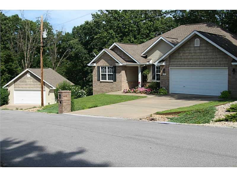 Need a 4-car garage or a workshop? Look no more! Great location near Back 40 trail and easy access to Hwy 71. 3 BR, 3BA split plan, granite counter tops, hardwood floors, eat-in kitchen plus formal dining, 2 walk-in closets in master, crown moldings, full house water filtration system, game room/second living area in lower level walk-out basement. Enjoy the outdoors from the king-sized deck with fire pit. Detached garage/shop (24x24) on adjoining lot. New Trane heat pump installed in 2019. Propane tank is owned and tank will convey. Propane remaining in the tank to be pro-rated at closing.