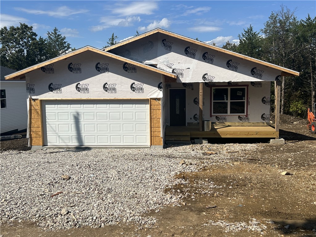 Brand New Construction! The finished home will be 3 BR, 2 BA, 1,286 SQFT, with a large open floor plan, open concept kitchen with island, covered front porch, 2x6 exterior walls, and a garage. The home is close to Bull Shoals Lake and Diamond City golf course. The house will have vinyl plank flooring in the living and kitchen and then carpet in the bedrooms. Come check it out today.