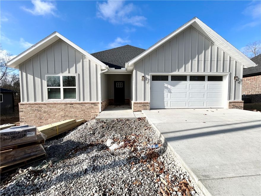 New construction on a beautiful .29 acre FLAT wooded lot located close to Branchwood Nature Trail, Highlands Golf Course, and Loch Lomond! Easy access to I-49! Step inside to discover an inviting open concept design featuring 10’ ceilings and beautiful floors that enhance the spacious feel of the home. The stylish kitchen is equipped with a gas range, 3 cm quartz countertops, custom cabinets, and a walk-in pantry. Entertain or unwind in the living area, complete with a stunning fireplace, or step out onto the covered patio to enjoy the peaceful surroundings. The primary suite features a massive walk-in tile shower and closet. 2 bedrooms + office. Buyer can receive $3,500 in closing costs when using the builder's preferred lender!