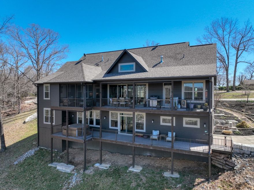 This amazing package is a rare sight! A main home with a great lake view, a guest house near the waters edge, and lake access to your own 2-slip private dock! The gorgeous 4 bed/4 bath, 4618 square foot main home sits above the cozy 1 bed/1 bath, 672 square foot “boat” house, and both are ready to entertain you and your friends! This home was recently constructed and has been excellently maintained! Stylish textures, colors, and materials flow throughout both houses and give this property a calm and fun feel. Amenities include concrete driveways and extensive landscaping, very large heated/cooled basement shop/hobby room, hot tub, screened deck with gas fireplace and wet bar, water treatment system, custom lighting, concrete security room, large bonus room above the garage, 2 whole house generators, security cameras, beautiful limestone walls and firepit hangout, 30x40 concrete shop foundation, and even wifi, lockers, and lifts at the dock! Literally too much to list and most furniture and furnishings are included!