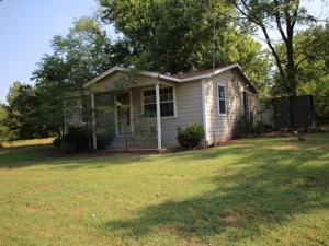 2 bedroom 1 bath fixer uppper on .65 acre lot. Storm Cellar and storage building.