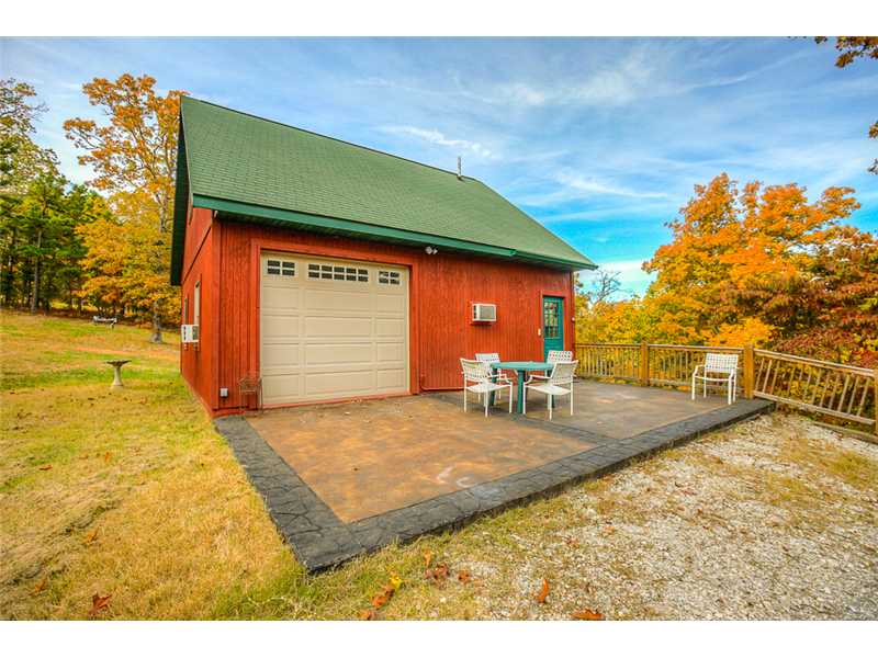 1 acre +/- Area of nice homes. Shared/ Private road leads you to your place of fun or tranquility! Great get away or perfect home site for a 3-6 bedroom home. Currently garage is converted into a cabin;sleeps 12. Can be cabin or garage for new home!,Please Be Sure You or your agent provides the attachment to explain detaiols on this unique and intriguing home site with 1 stall private boat dock with lift. Only 15 minutes to Rogers!
