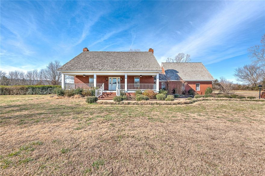 Rare opportunity to own over 7 acres in the heart of Elkins with a beautiful home full of Southern charm and timeless character. This inviting property features a wide, welcoming front porch—perfect for relaxing and enjoying small-town living—and offers incredible potential with just a little TLC. Inside, you’ll find three fireplaces, formal living and dining rooms, and a spacious family room, creating ideal spaces for both everyday living and entertaining. The large primary suite is conveniently located on the main level, while additional bedrooms are all generously sized on the 2nd level. An office located above the garage provides a quiet, private workspace—perfect for remote work or creative pursuits. Surrounded by open space and built away from the road, this property offers the rare combination of acreage, privacy, and in-town convenience. With its classic design and exceptional setting, this home is ready for someone to bring it back to its former glory.