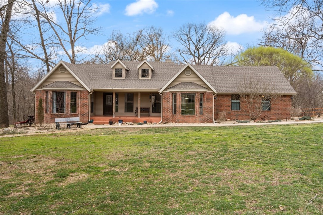AMAZING hard to find Estate property with 7.16 park acres close to Coler Mountain Bike Park, and Elementary school, Shopping, Hospital, minutes from Dt Bentonville and WMT home office. Property includes 800 sq ft guest home and 40X50 Insulated 4 Bay Shop. Located outside city limits with less restrictions. This property is also listed as development potential, subject to rezoning. Front Porch and back deck are covered. A ramp is provided at side of home to deck for wheel chair accessibility.
Carroll Electric and Bentonville Public Water