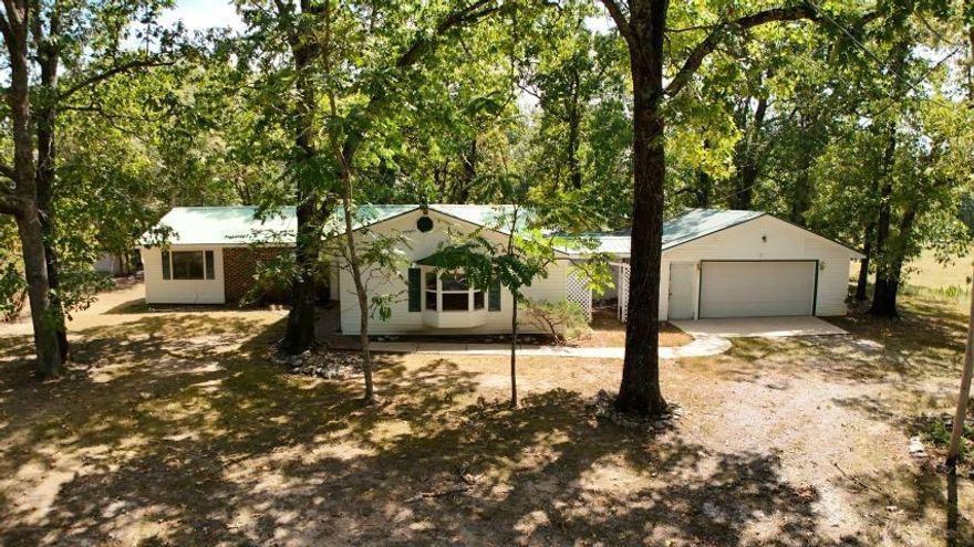 Charming 3 bedroom, 2 bathroom home situated on 6.99 acres just minutes from Mountain Home, Norfork Lake, and the White River. Home features a bright sunroom, spacious deck, and an attached 2-car garage. A large barn/shop on the property provides excellent space for storage, hobbies, or workspace. Perfect for those seeking peaceful country living with easy access to outdoor recreation.
