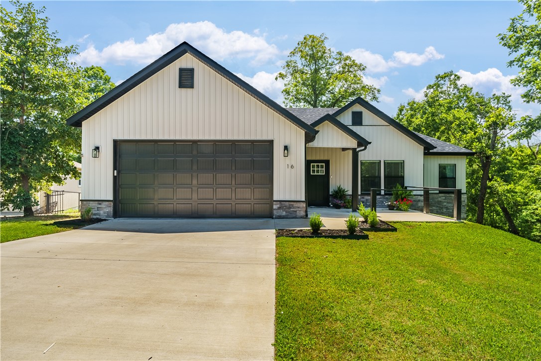 Welcome to this lovely 2-year-old home nestled in a quiet cul-de-sac! This 3-bedroom plus office home offers an open concept and desirable split floor plan on a mostly flat 0.46-acre lot. The spacious kitchen features thick granite counters, a large pantry, and ample prep space—perfect for entertaining. Custom touches include shiplap walls, a stunning floor-to-ceiling floating gas log fireplace, and a large laundry/mudroom. The vaulted-ceiling primary suite includes two large closets, a double vanity, tiled walk-in shower, and luxurious jetted tub. The office, with a closet, can easily serve as a guest bedroom. Enjoy outdoor living on the large back deck—partially covered—overlooking a fully fenced yard with a 6-ft gate. Located just minutes from Branchwood Rec Center, Bike trails, Highlands Golf Course & Pub, Lake Loch Lomond, and with quick access to the Highlands exit on I-49, this home blends comfort, quality, and convenience. (Built with a 3-bedroom septic tank.)