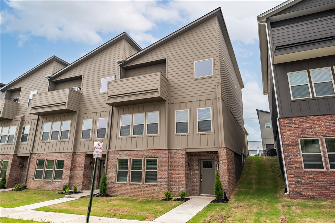 Nestled in the heart of Fayetteville, this modern townhome offers the perfect combination of luxury, convenience, and comfort. This townhome has 2 living areas, 3 bedrooms, 2 and a half baths, and 2463 square feet of living space, this residence provides ample room for your family to flourish. The kitchen features granite countertops, stainless steel appliances, a spacious island, and custom cabinetry, making it the perfect space for cooking and entertaining alike. This townhome offers easy access to I49, top-rated schools, shopping centers, dining destinations, and recreational facilities, ensuring that everything you need is minutes away.