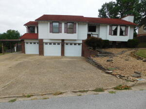 Beautiful 2420 sq ft 3 BR, 2 1/2 BA home on two lots in Harrison's Golf Course community. Home has had new updates including new laminate flooring, paint and kitchen countertops. Features of the home include large open living and dining area, basement area with a wood stove, oversized 2 car garage with a bonus golf cart stall, attached carport, outdoor entertainment area with covered deck, storage building and privacy fence.