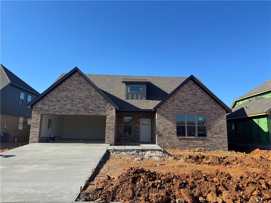 New construction home in Woodlands Crossing! This east facing 4- bedroom (2 up and 2 down), 3 full bath home features 3 cm quartz counters, upgraded tile, a designer brick fireplace, 4 disk lights in all of the bedrooms, a dresser in the primary bedroom closet, a barn door in the primary bedroom, and a craftsman feel. Other amenities include custom cabinets with soft close hinges, stainless steel appliances with a designer gas range vented to the exterior, tall ceilings, low-e windows, designer lighting, luxury vinyl plank flooring, low-e windows, 2" faux wood blinds, full privacy fence, full gutters with downspouts, irrigation system in the front and back w/ an exterior control, lots of trees and more! The community is located in the Bentonville School district and is just minutes from fine dining, entertainment, and the Bentonville Community Center. Preferred lenders are paying up to $5,000 toward closing costs, prepaids, or discount points!