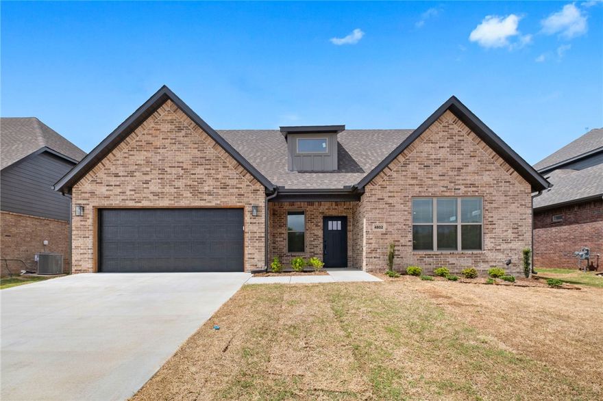 New construction home in Woodlands Crossing! This east facing 4- bedroom (2 up and 2 down), 3 full bath home features 3 cm quartz counters, upgraded tile, a designer brick fireplace, 4 disk lights in all of the bedrooms, a dresser in the primary bedroom closet, a barn door in the primary bedroom, and a craftsman feel. Other amenities include custom cabinets with soft close hinges, stainless steel appliances with a designer gas range vented to the exterior, tall ceilings, low-e windows, designer lighting, luxury vinyl plank flooring, low-e windows, 2" faux wood blinds, full privacy fence, full gutters with downspouts, irrigation system in the front and back w/ an exterior control, lots of trees and more! The community is located in the Bentonville School district and is just minutes from fine dining, entertainment, and the Bentonville Community Center. Preferred lenders are paying up to $5,000 toward closing costs, prepaids, or discount points!