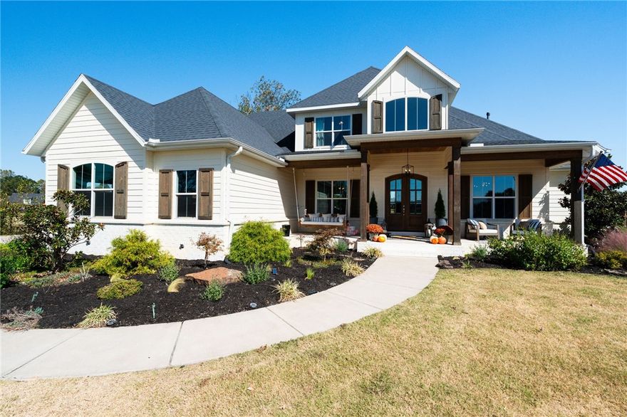 Welcome to 1315 River Hollow Rd, Fayetteville, AR! This 4-bedroom, 3.5-bathroom, 3,685 sq. ft. home sits on 2 beautifully landscaped acres with access to the White River and close proximity to Beaver Lake. The kitchen is a culinary dream with quartz countertops throughout, a butler’s pantry, and a beverage fridge. Enjoy stunning hardwood floors, a gas log fireplace with  stone, large windows, and reclaimed 1800s beams from a barn in Oklahoma. The house has upgraded lighting throughout. Outside, unwind on the covered porch with a vaulted wood ceiling, outdoor gas fireplace, grilling area, and fire pit. With access to community tennis courts and generous indoor storage, this home offers luxury, comfort, and convenience in one. Schedule your showing today!