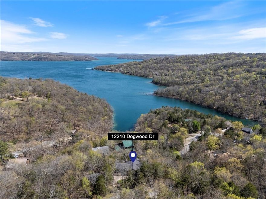 Lake View Living at Its Finest – Fully Furnished & Turn-Key! 4 Bedrooms | 3 Bathrooms | Sleeps 12 | Stunning Lake Views | Vacation Rental Potential -Big views and even bigger memories await at this beautifully maintained lake-view retreat—perfect for a large family getaway or a high-performing vacation rental investment. .Inside, enjoy an open-concept kitchen and dining area with warm hardwood floors and a cozy fireplace—ideal for hosting meals after a day on the water. The upper-level sunroom showcases panoramic lake views and includes a daybed and sleeper sofa, making it the perfect spot for morning coffee, sunset lounging, or additional sleeping space.Downstairs, the lower-level family room is built for fun with two sets of bunk beds, a pool table, and a comfortable sectional—an ideal hangout for kids or groups. Step outside to a partially covered deck, perfect for outdoor dining and entertaining, while the fenced backyard offers a safe space for pets to play.