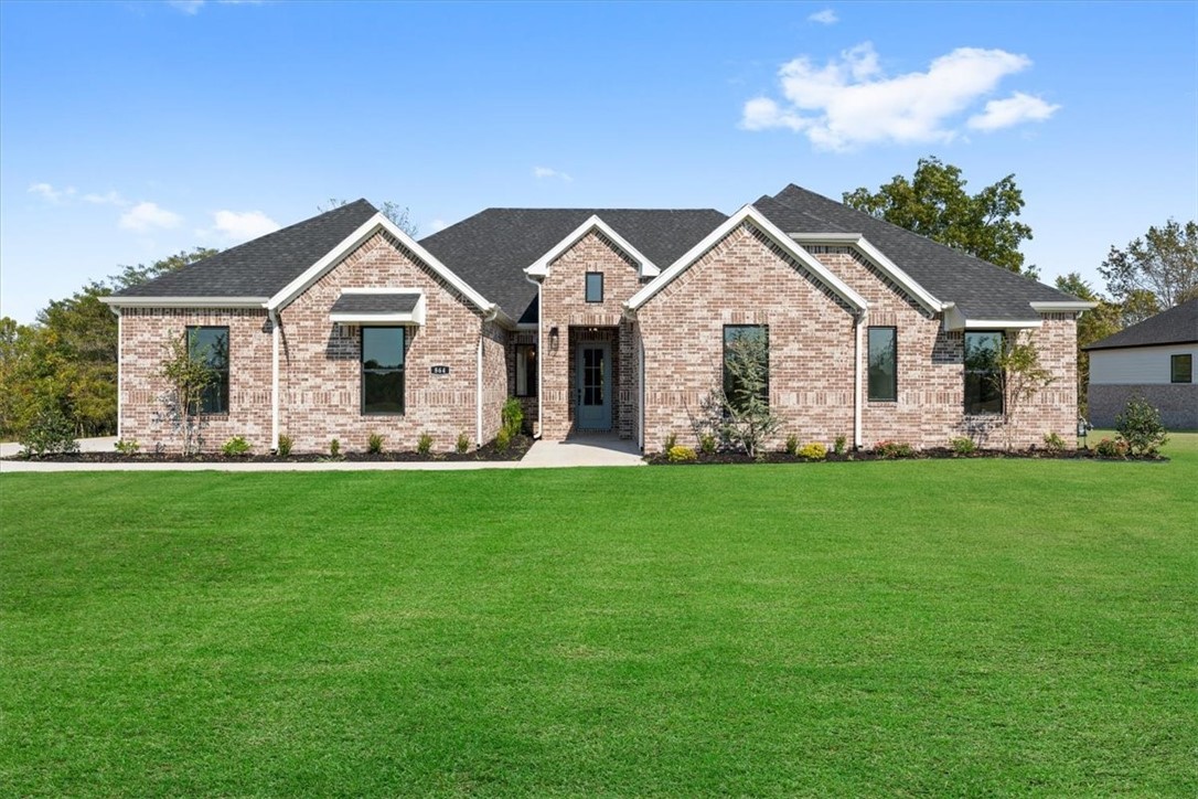 Precious Payton Plan - 4 Bedroom, with a Study/Game room, 3.5 Bathroom and a 3 Car Garage! Fabulous back Patio. Huge Walk in Pantry. Luxurious Bedroom One with a fabulous en suite bathroom with a Walk-in Shower and Soaking Tub. Kitchen boasts cabinet to ceiling cabinets, quartz counters, farmhouse sink and Kitchen Aid Stainless Steel Appliances with double ovens! Black fixtures! LED Lighting! Ceiling fans!! Mix of Brick and Hardie board exterior per plan. Asher's Ranch is an idyllic community nestled in the heart of Goshen, Arkansas, known for its picturesque landscapes and serene surroundings. The community boasts meticulously designed and built homes that are situated on expansive lots, with ample space for outdoor activities, gardening, and privacy. The homes are crafted to perfection, featuring modern amenities and elegant finishes that exude luxury and comfort. Come to Asher's Ranch and find your dream home today! Taxes TBD.