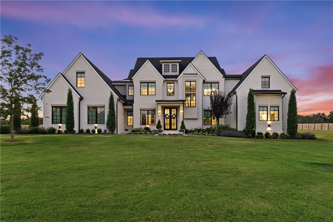 Step into luxury with this magnificent estate, set on 1.5 acres of lush, landscaped grounds. Conveniently located just minutes from Downtown Fayetteville, I-49, this home provides a seamless blend of country tranquility and urban convenience. Designed with elegance in mind, the home features French oak floors, designer lighting, and beautiful arches throughout. Each bedroom is a serene retreat with walk-in closets, and the bathrooms offer a touch of luxury with marble floors. This estateās superior design has earned two awards from the Arkansas Interior Design Society. The outdoor space is a true haven for entertaining and relaxation, with an 18x36 heated gunite pool, a fire pit, a pergola with a grill station and outdoor beverage refrigerator, and a putting green for golf practice. With ample space for hosting gatherings and enjoying luxurious outdoor amenities, this home epitomizes sophisticated living. Schedule your private tour today to experience the unparalleled luxury of this award-winning estate.
