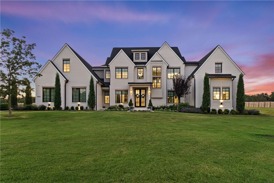 Step into luxury with this magnificent estate, set on 1.5 acres of lush, landscaped grounds. Conveniently located just minutes from Downtown Fayetteville, I-49, this home provides a seamless blend of country tranquility and urban convenience. Designed with elegance in mind, the home features French oak floors, designer lighting, and beautiful arches throughout. Each bedroom is a serene retreat with walk-in closets, and the bathrooms offer a touch of luxury with marble floors. This estate’s superior design has earned two awards from the Arkansas Interior Design Society. The outdoor space is a true haven for entertaining and relaxation, with an 18x36 heated gunite pool, a fire pit, a pergola with a grill station and outdoor beverage refrigerator, and a putting green for golf practice. With ample space for hosting gatherings and enjoying luxurious outdoor amenities, this home epitomizes sophisticated living. Schedule your private tour today to experience the unparalleled luxury of this award-winning estate.