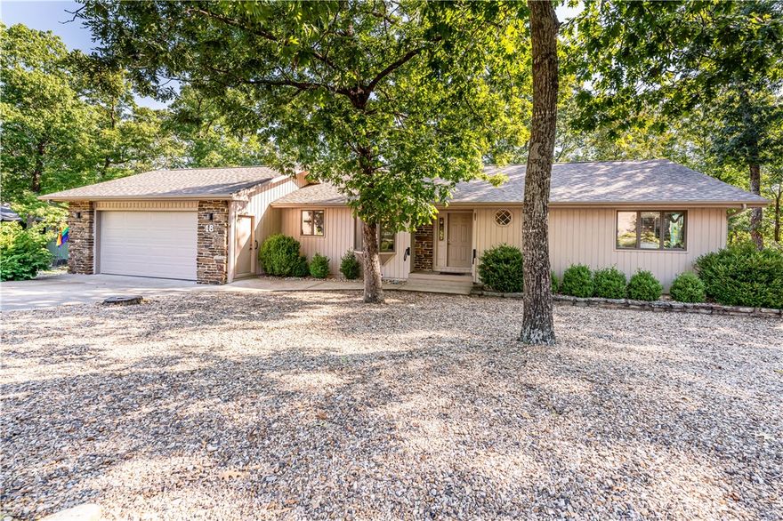 Located in a friendly, social neighborhood near the golf course, this well-designed home offers an inviting blend of comfort and convenience. Enjoy elevated east-facing views that stretch for miles, perfect for morning coffee from the screened gazebo on the back deck. The main level features two bedrooms, two full baths, a spacious kitchen and dining area, laundry, and a two-car garage. Downstairs, you’ll find another bedroom, a full bath, a cozy den, and a heated and cooled workshop—easily adaptable into an additional kitchen or hobby space. An extra lot to the south provides added privacy and room to expand. With shopping, restaurants, marina access, two golf courses, and scenic walking trails all nearby, recreation and amenities are always close at hand. Plus, historic Eureka Springs is just five miles down the road, offering even more charm, dining, and entertainment. This home balances peaceful living with easy access to everything you need.