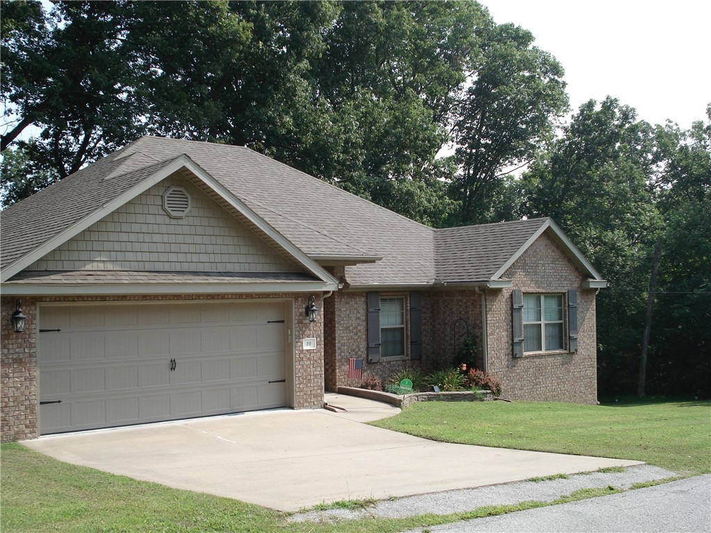 Very Modern home. High Ceilings, Luxury Vinyl. New Granite. Split floor plan. On slab. Great yard and views off of deck. Move in ready home. 1/2 Mile from Lake Windsor, Bella Vista's second largest lake and 2.5 Miles from full service Marina at Loch Lomond, Bella Vista's Largest Lake.