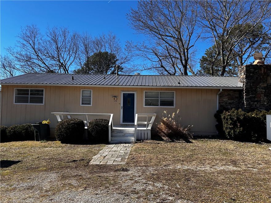 Centrally located 2 bed 2 bath home move in ready. 
New metal roof and separate heating systems plus a large wooden fireplace. Turn the walkout basement into another living quarters. Basement has separate HVAC.
Gas range and cooktop for even cooking. Serve your meals on the back deck for lounging and listening to town. 
Close to amenities of town, minutes from downtown. 
Septic recently serviced and cleaned. Washer, dryer, and fridge convey.