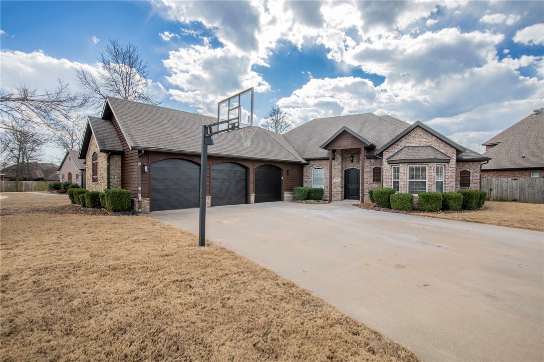 This stunning single-level, 4-bedroom, 3-bathroom home, nestled in the sought-after Wildwood subdivision in Bentonville, AR, has been beautifully remodeled with modern finishes throughout. The open-concept living spaces are bathed in natural light, highlighting the gleaming hardwood floors and stylish design. The gourmet kitchen features sleek countertops, high-end appliances, and ample cabinet space, perfect for entertaining. The master suite offers a peaceful retreat with a luxurious en-suite bath, complete with a soaking tub and walk-in shower. Outside, the home boasts a spacious 3-car garage and a well-maintained yard. Residents of Wildwood enjoy access to community amenities, including a sparkling pool and a charming park, making it an ideal location for families.