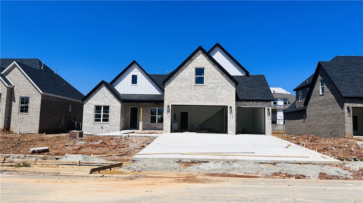 New Construction in SW Bentonville! The Ferndale Plan. Home features 4 bedrooms, 3.5 baths, study, and bonus room. 3 Bedrooms on lower level and 1 bedroom plus bonus upstairs. Walking distance to Central Park Elementary School. Quality modern finishes. Upgraded amenities include 10' ceilings on 1st floor, 2-50 gallon water heaters w/ circulation pump, 6' soaker tub, cedar beams, ceiling high kitchen cabinets, covered outdoor patio with fireplace, center vac, & more. Great open plan - spacious kitchen with center island, double ovens, hooded vent, & custom cabinets. Living room and patio wired for sound. Welcome home to Clarendon Heights!