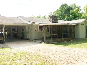 Don't miss this rare opportunity to own a 3 bedroom home with a view of the lake on 4 lots in Lead Hill with a boat dock! Jetted tub in bathroom, newer cabinets, gas fireplace, sunroom, partially finished basement, private setting, fenced yard. What more could you need?