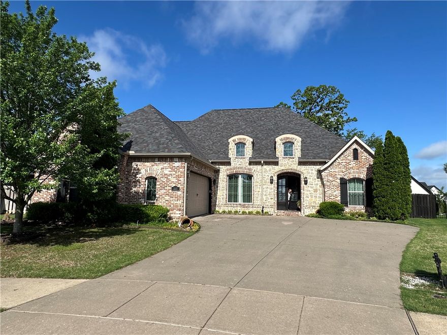 Come home to elegance and comfort in Turnberry at The Peaks. This 5-bedroom, 3.5-bath home offers a smart split floor plan with hardwood floors, brick accents, and granite throughout. Three bedrooms are on the main level, with two more and a bonus room upstairs. The kitchen is a chef’s dream with double ovens, gas cooktop, pot filler, copper farmhouse sink, large island, and butler’s pantry. The primary suite includes a spa-like shower and a walk-in closet that connects to the laundry room. Outside, enjoy a covered patio with gas log fireplace, built-in grill, and A/V connections—perfect for entertaining. You’ll fall in love!