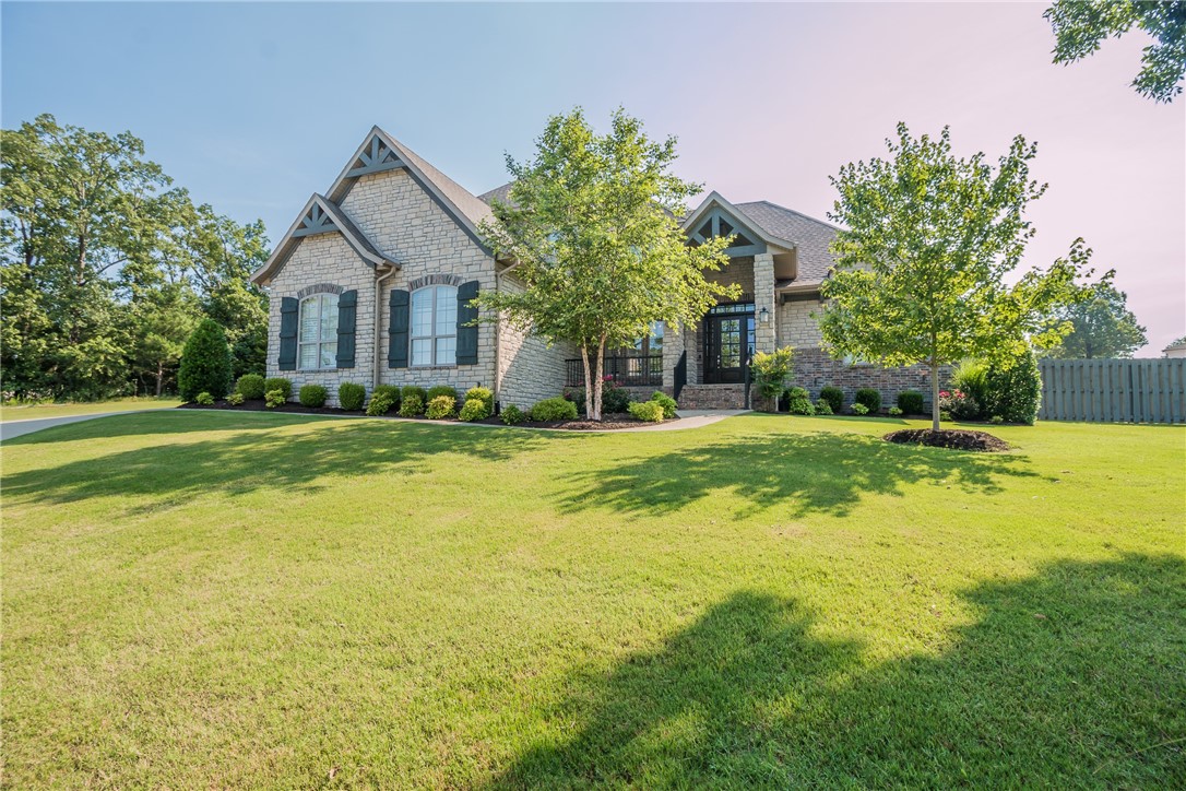 Gorgeous home in Sloan Estates a brief 2.5 miles from highly sought after Vandergriff Elementary with all the custom extras! Open floor plan with wood flooring throughout main level and plantation shutters. Kitchen includes custom cabinetry, large island, Quartz counter tops and Energy Star appliances. Host the big game in the home theatre w/ 165" screen, theatre seating and sound system. Home is fully wired for security/sound, has upgraded tile in bathrooms, upgraded closet shelving throughout, beautiful built-ins, tile work above and beside mantle, hand-hewn beams in the office and walk-in shower in master. Garage has plantation shutters, custom cabinetry, epoxied floor and quiet-close garage doors. Outdoor living space includes a covered patio with outdoor kitchen, built-in smoker and gas grill with mounted TV to convey. Extensive landscaping package, irrigation system, upgraded uplighting on the front and down lighting in back with newly installed retaining wall and exterior lighting.
