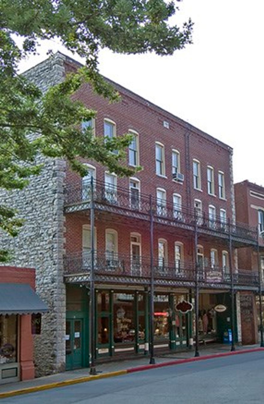 23 guest suites, 3 retail spaces, restaurant, 30 parking spaces in downtown Eureka Springs.