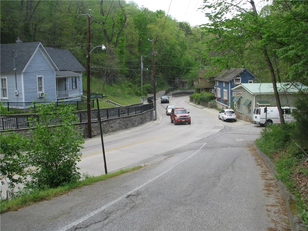 One lot has been surveyed is 40' X 80' going uphill. This lot adjoins 2 other lots that are being sold together for $15,000 (MLA# 1215040). Two different sellers but if a buyer purchases the 3 lots, tyhey would have 120' frontage by 80' deep. Walk downtown to restaurants, bars, the museum and bank and more shopping. Priced lower to account for the steepness of the terrain.
