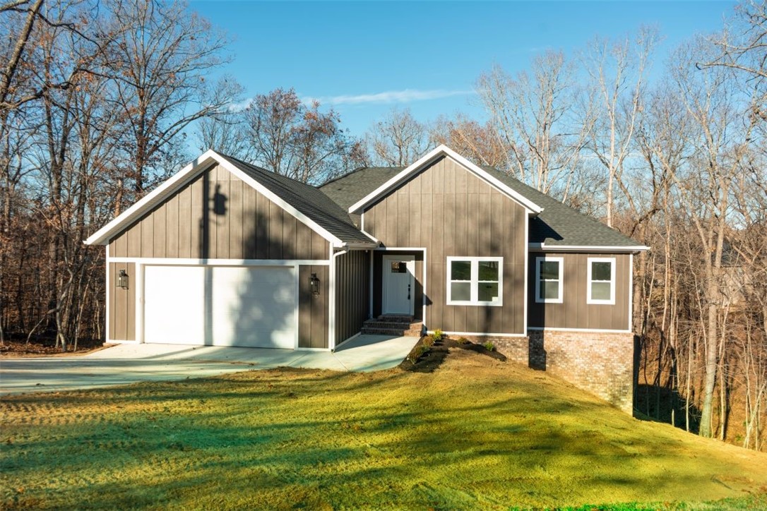 $1,500 preferred lender credit through Gateway. If you enjoy the outdoors, have a look at this charming 3 bedroom 2 bath home. With an open floor plan that's ideal for both everyday living & entertaining. Large windows provide plenty of natural light & views of the woods. The designated office provides a comfortable & private workspace that could double as a 4th bedroom. Step outside to the patio, where you can enjoy coffee or host a barbecue while overlooking the enchanting woods. This serene setting has easy access to both paved and mountain biking trails just a stone's throw away.