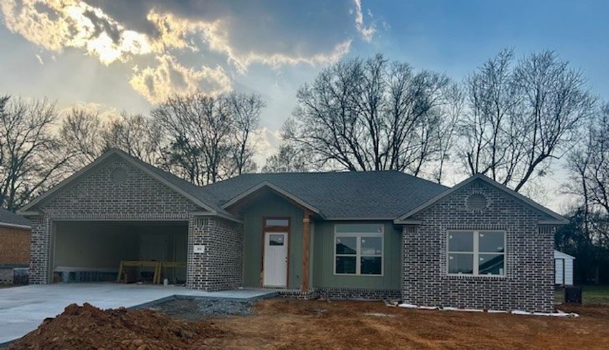 WELCOME HOME to this beautiful 3-bedroom, 2-bath brick home in a lively new subdivision just minutes from Mount Nebo State Park. Designed with a desirable split floor plan, this home offers both comfort and privacy. The open-concept living and kitchen area is perfect for everyday living and entertaining, featuring a spacious dining area, large island, and a generous pantry. Thoughtful layout and quality finishes throughout make this home as functional as it is inviting. Enjoy the charm of a growing neighborhood with easy access to outdoor recreation, scenic views, and modern conveniences.