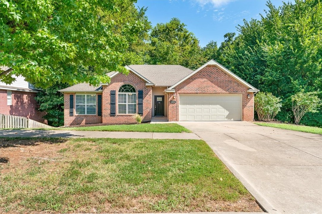 Nestled out on the edge of town but still just minutes from all things Fayetteville sits a lovely little home that is shady in all the right ways. Think dappled sunlight, the rustle of leaves overhead, and a deck that practically begs for a frozen margarita on a lazy afternoon. Out back you’ll find a canopy of mature trees that keeps things cool in the heat of summer. Sure, the grass doesn’t love all that shade in the back yard, but that’s your chance to skip mowing and dream bigger. A few flagstone paths, some lush shade-loving plants, maybe a hammock tucked in the corner and suddenly you’ve got yourself a backyard oasis that’s more secret garden than suburban lawn. And you can focus on all that because the house has already gotten a good sprucing up. New paint, LED fixtures, carpet and a nice deep clean inside. Outside a new privacy fence, repainted deck and a ton of landscape cleanup. All that just 5 mins from I-49, 10 from the UA and 15 from downtown, and everything else you need lies somewhere in between.