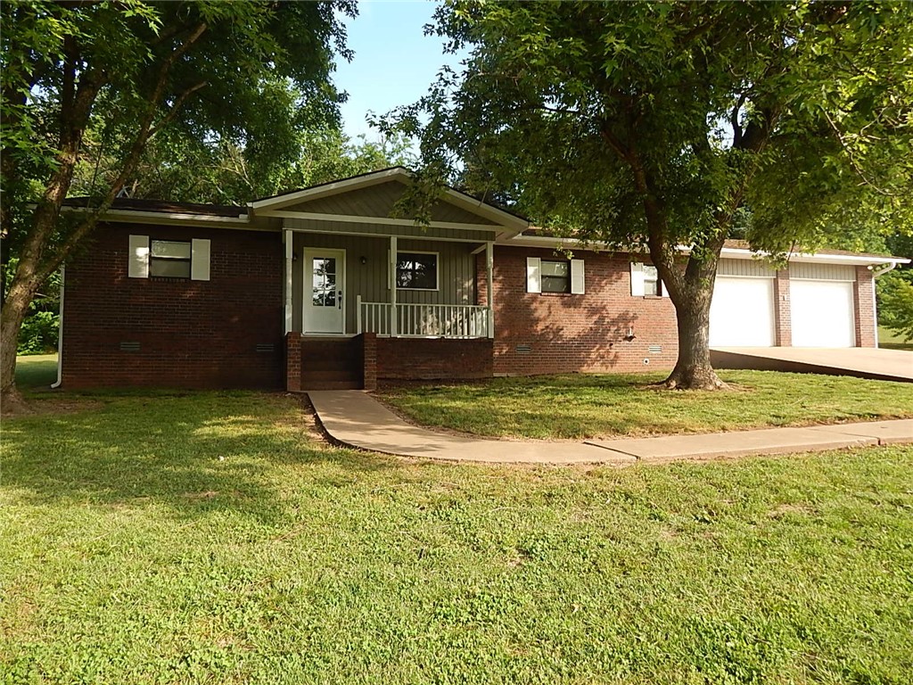 This 6+ acres and beautifully redone home is just a short distance to Berryville. North of Berryville rarely has property for sale. NEW- patio doors, light fixtures(fandeliers)ceiling fans, electric connections, paint, trim, doors, well pump, sinks and toilets, some flooring. Double closets in all bedrooms, huge living room-split floor plan with master suite on one side, Large bay window with seating. 768 sq ft. barn with covering on side, attached large garage, fruit trees, nice roof, such a great place for family or retirement. Custom built home. Fireplace is woodburning with ducting so can heat whole home-woods in back part of property for firewood.