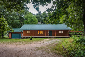 Country road living just minutes from Branson, MO or Harrison, AR and the lake! Your family will love to grow in this large three level, log sided, home with newer metal roof. Gorgeous Brazilian Tigerwood laminate flooring is just one of the recent updates which also include; fresh and neutral paint, new doors, handles, light fixtures, tile flooring, carpet, appliances, bathroom fixtures, AC unit, well pump and more. Large bedrooms, full bathrooms on each level, full basement with rec rooms, custom cedar office with built in desk, electric fireplace, and ''hive'' style ceiling fan, Billiard room, uniquely designed with reclaimed 100 year old oak complete with pool table, are just some of the other amenities of this wonderful place you could call Home! More land available. MLS 138736