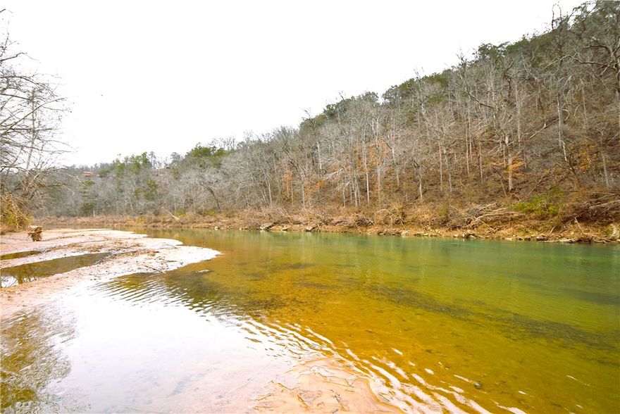 This Beautiful 11.01 acre Kings River front tract is now available to build your Dream home! This property will allow the owner to build on the higher side for great views & walkout basement and also has the community access area nearby to launch all your Kayaks & Canoes on one of the most incredible small mouth bass waters anywhere! The subdivision also has a gated entry for added privacy and protection. The community access area has ample parking and a great access area to launch from. It's also very handy after floating the river from farther south to exit from right near your home, only a few hundred yards. Shopping can be had nearby in Historic Eureka Springs or Berryville Arkansas which has a super Walmart. Riverfront properties are getting harder to find and they're not making any more of it, so don't let this chance pass you by. Check it out today.