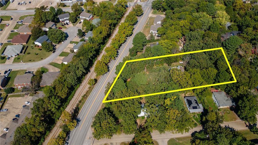 Prime .73-acre lot in a central Fayetteville location! Property includes a house considered a tear-down, offering the perfect canvas for redevelopment. Currently zoned residential, but sellers have met with the City and rezoning to multi-family may be considered with proper due diligence. This property provides a variety of possibilities in a highly desirable area near the University of Arkansas, Wilson Park, bus routes, and with easy access to I-49. Buyer is responsible for verifying zoning and development options.