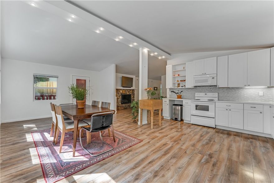 Beautifully updated mid-century home on a quiet dead-end street in Bella Vista. Thoughtfully remodeled before the current owners purchased in Feb 2025, featuring a newer roof, HVAC, and modern finishes throughout. Bright and open layout with abundant natural light, hard-surface floors, and a stunning stone fireplace. Recent upgrades include connection to city sewer and refreshed landscaping. Enjoy a spacious deck overlooking wooded surroundings, plus a walk-out basement with ample room for bikes, kayaks, and outdoor gear. Just steps from the Back 40 Trail and minutes to lakes, golf, and downtown Bentonville